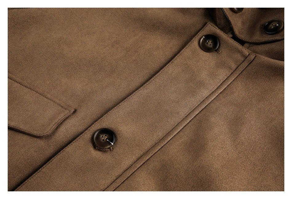 Close-up of the jacket's tan-brown button placket and flap pocket.