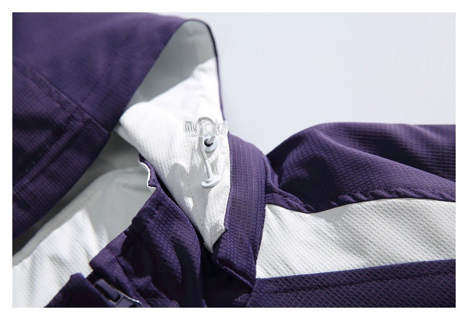 Close-up of the purple jacket's hood drawcord, collar, and white shoulder panel.