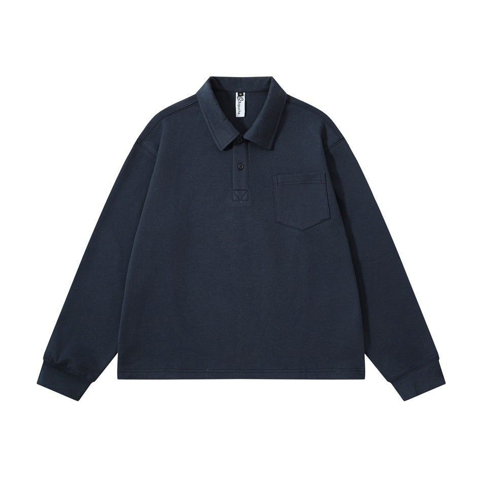 Navy blue long-sleeve polo-collar top with two-button placket and chest pocket, flat lay front view