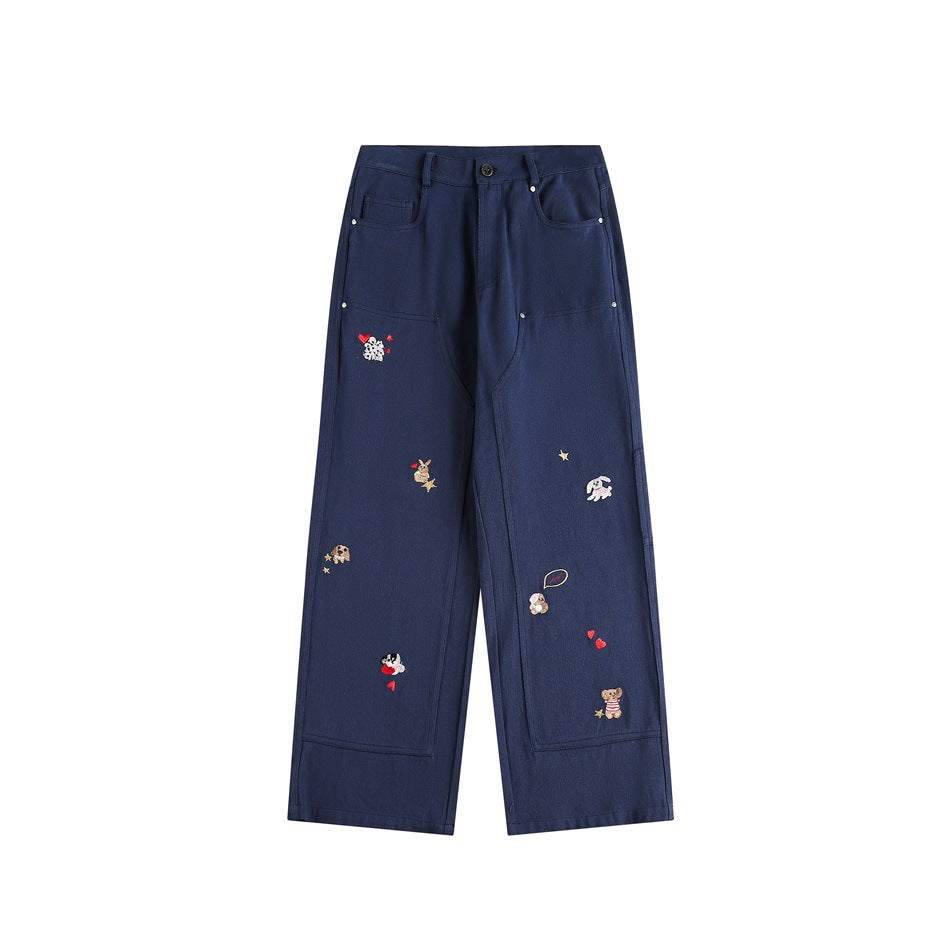 Navy wide-leg carpenter pants with small embroidered animals, hearts and stars, flat front view