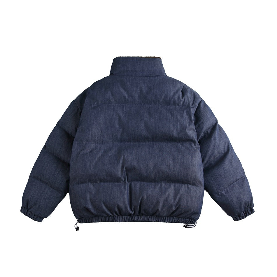 Back view of a navy padded jacket with a high collar, horizontal quilted sections, and gathered cuffs and hem.
