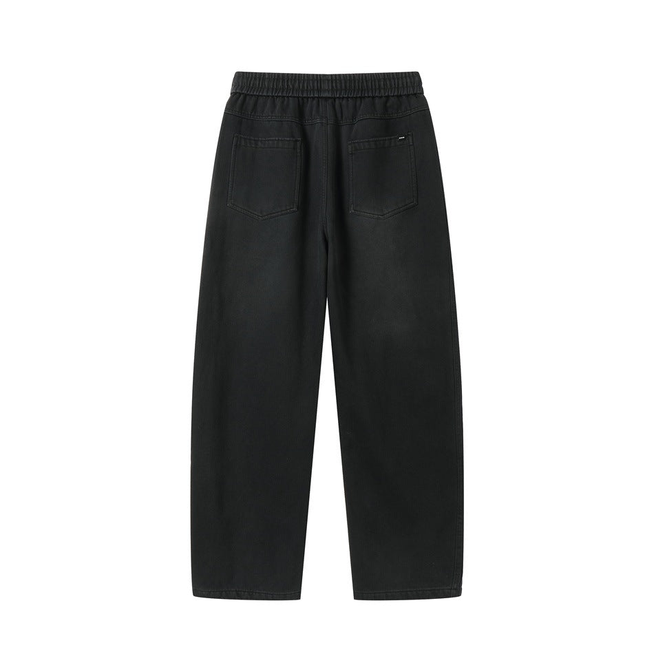 Back view of black washed pants with elastic waistband and two patch back pockets