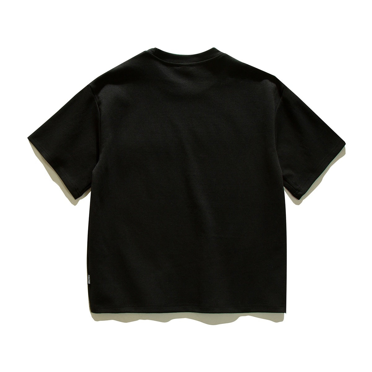 Back view of a plain black short-sleeve crew-neck T-shirt laid flat on a white background.
