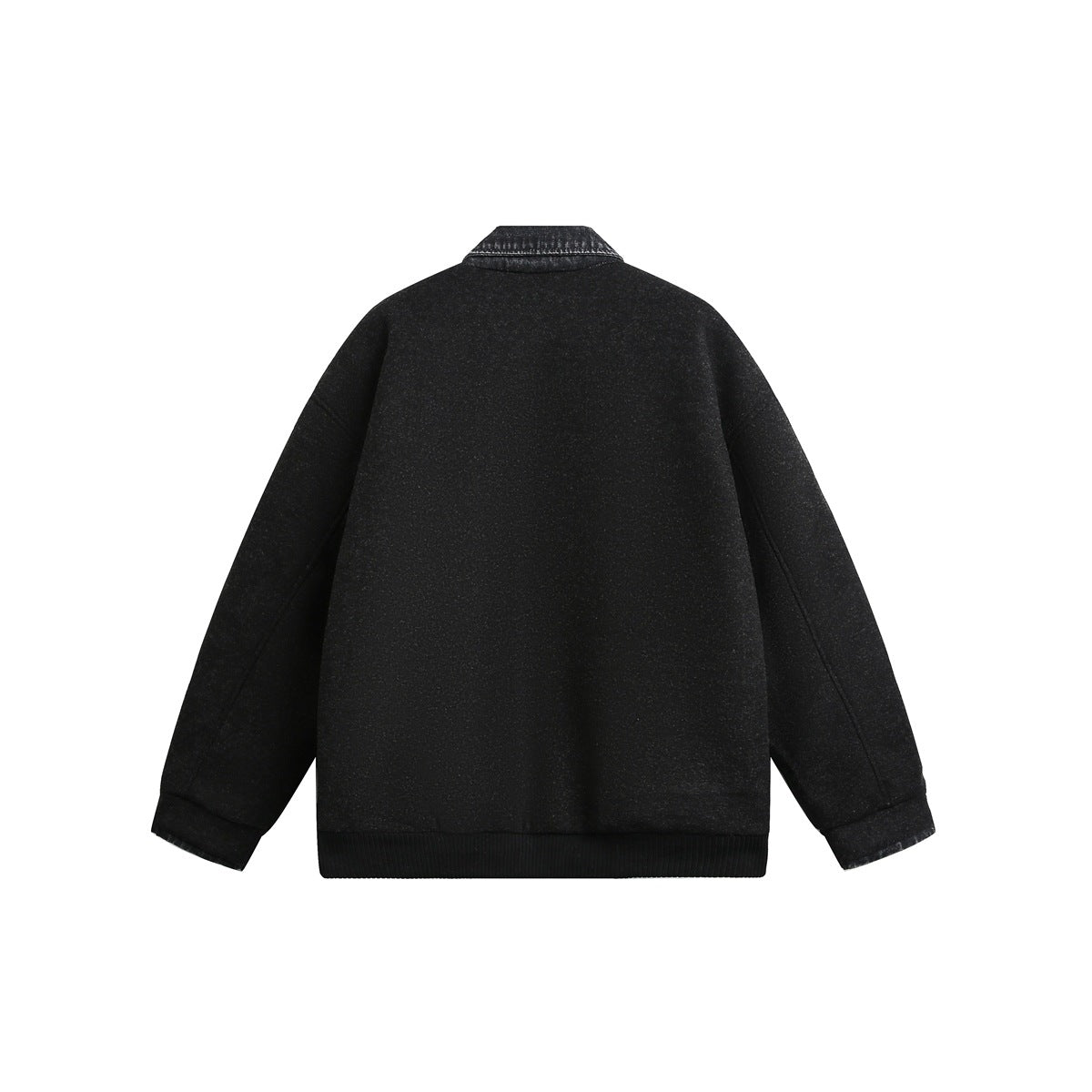 Back view of a black jacket with a dark denim collar, long sleeves and ribbed hem.