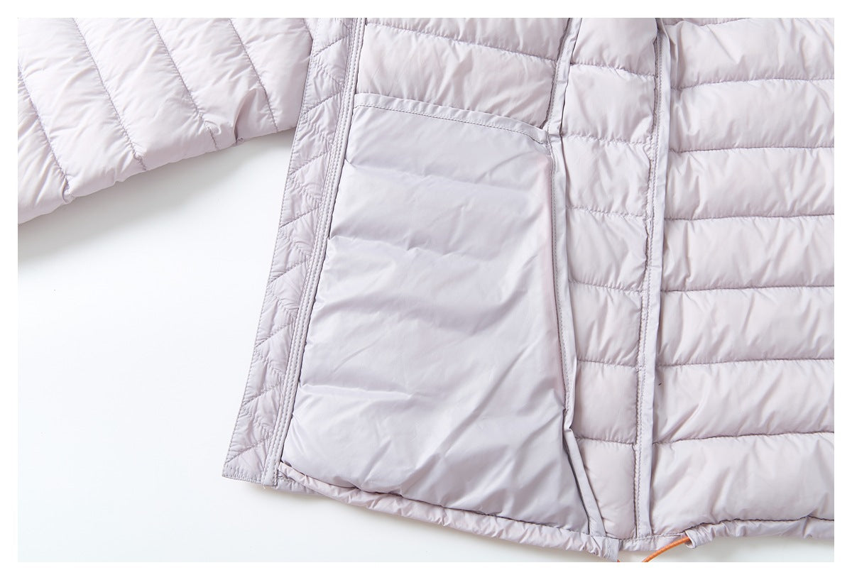 Close-up of the open front of a pale lavender quilted jacket, showing its lining and pocket area.