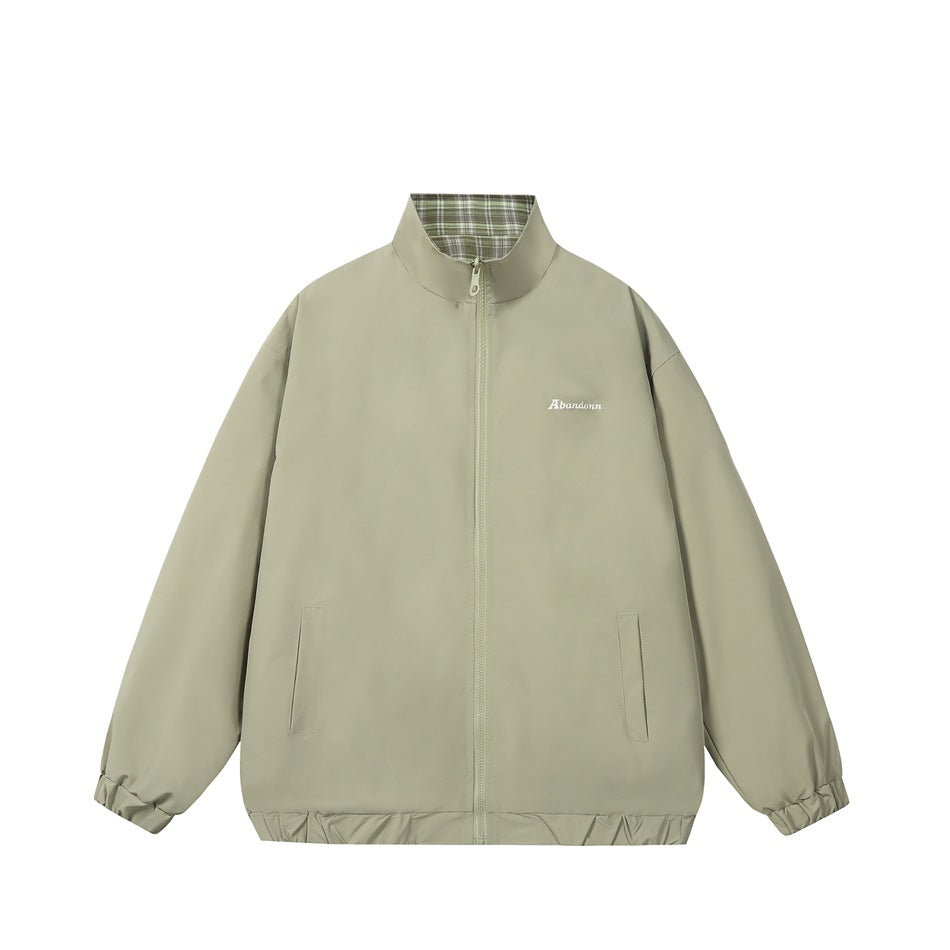 Light army green reversible stand-collar zip jacket, front view, with plaid inner collar and small white chest embroidery
