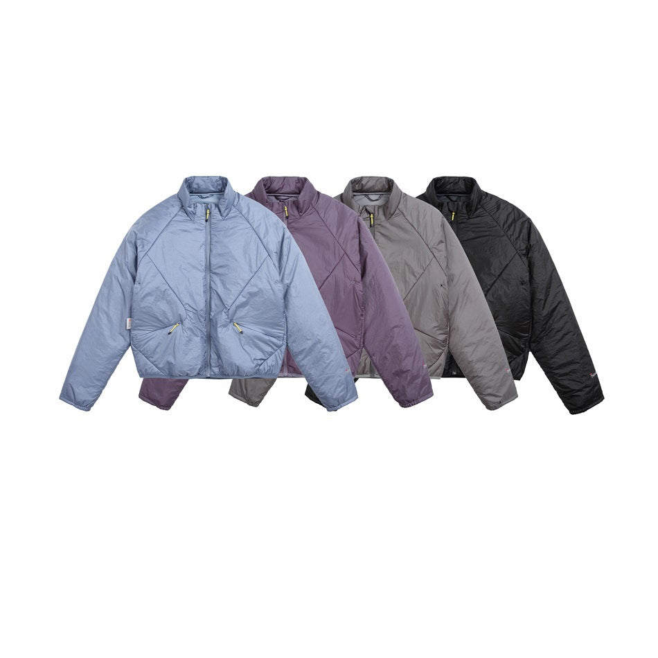 Four quilted zip jackets shown together in light blue, purple, gray, and black.