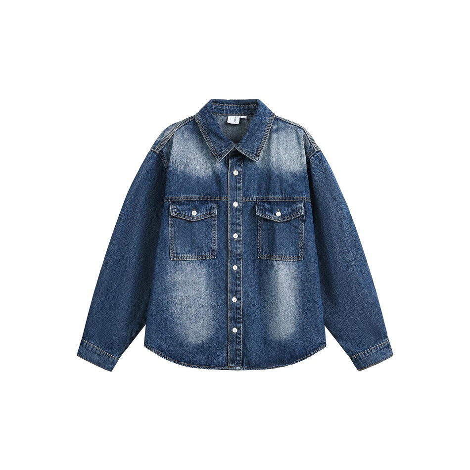 Washed blue denim long-sleeve shirt with chest flap pockets and button front, flat lay on white