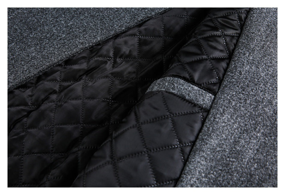 The garment is opened to show black diamond-quilted lining beside the charcoal outer fabric.