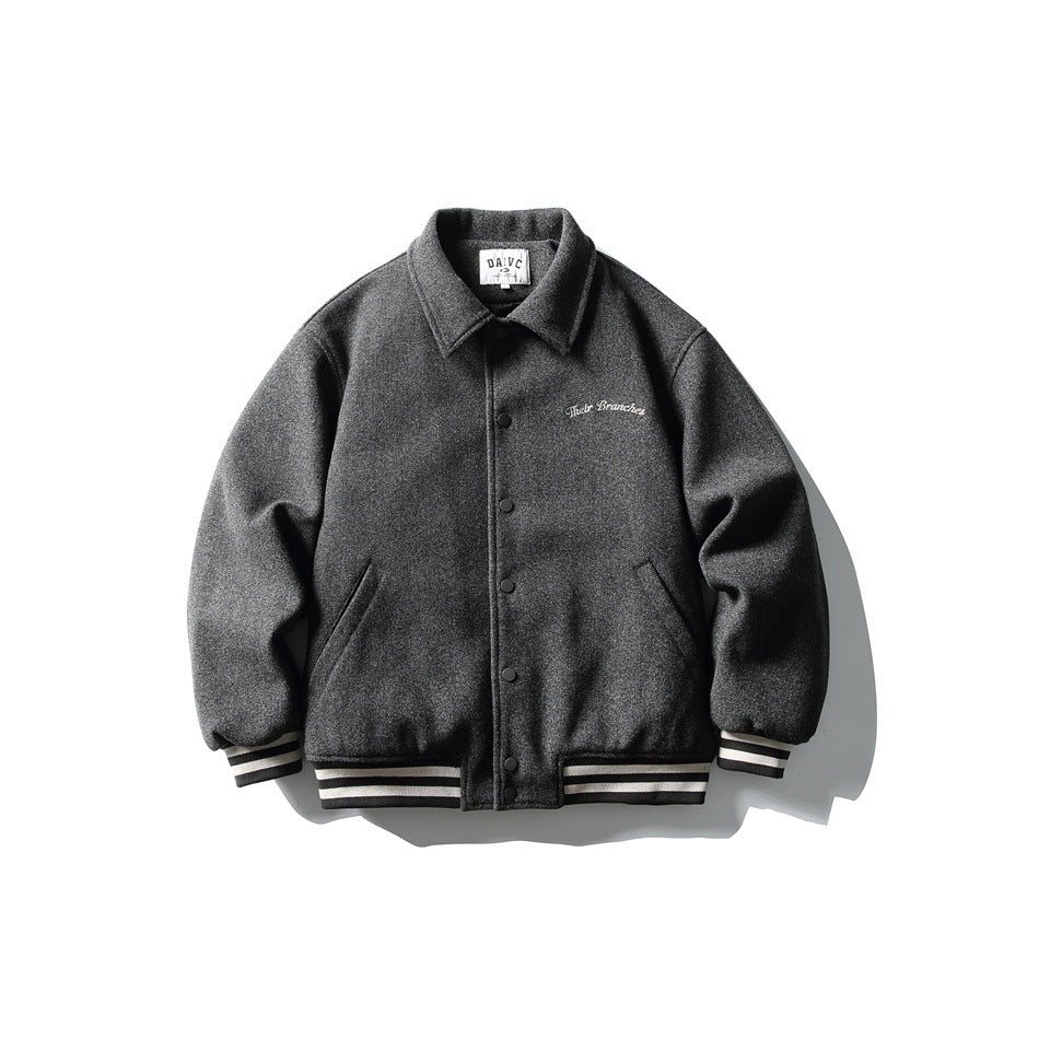 Dark gray varsity-style jacket with collar, snap buttons, striped cuffs and hem, and white script chest embroidery