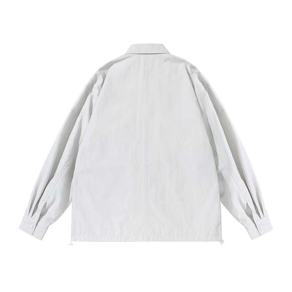 Back view of off-white shirt-style jacket with center back seam, pleated cuffs and drawstring hem