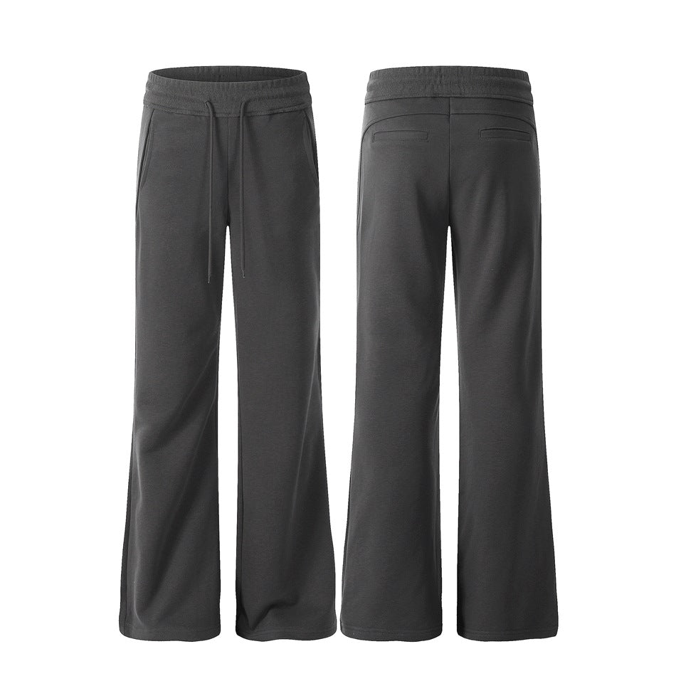 Charcoal wide-leg pants shown from the front and back, with a drawstring waist, side pockets, and two rear welt pockets.
