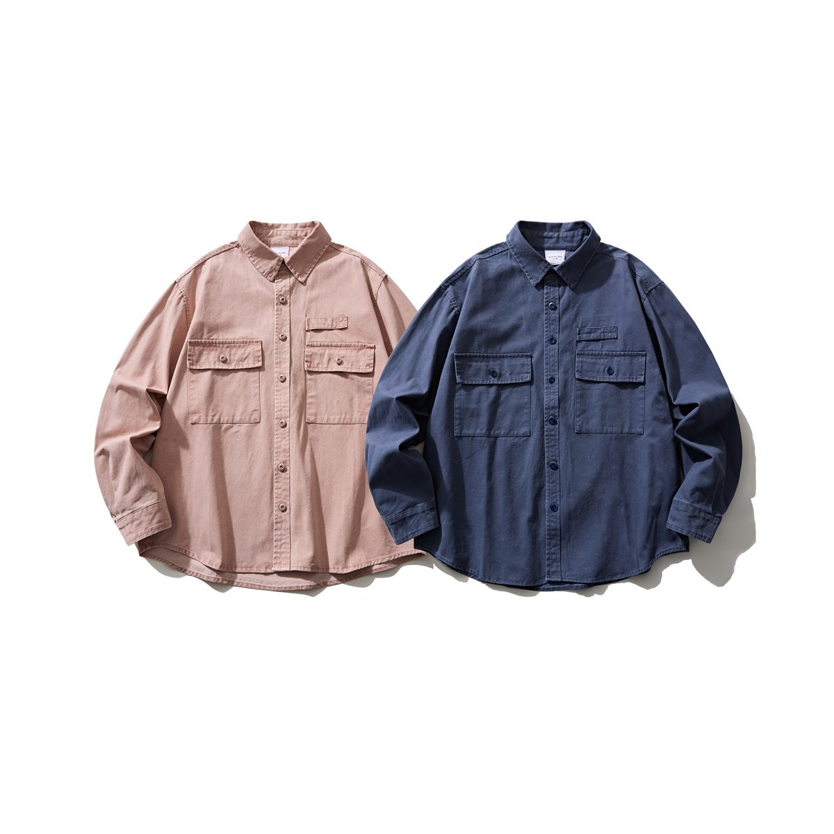 Two long-sleeve button-up shirts displayed from the front: dusty pink and dark navy, each with chest pockets.