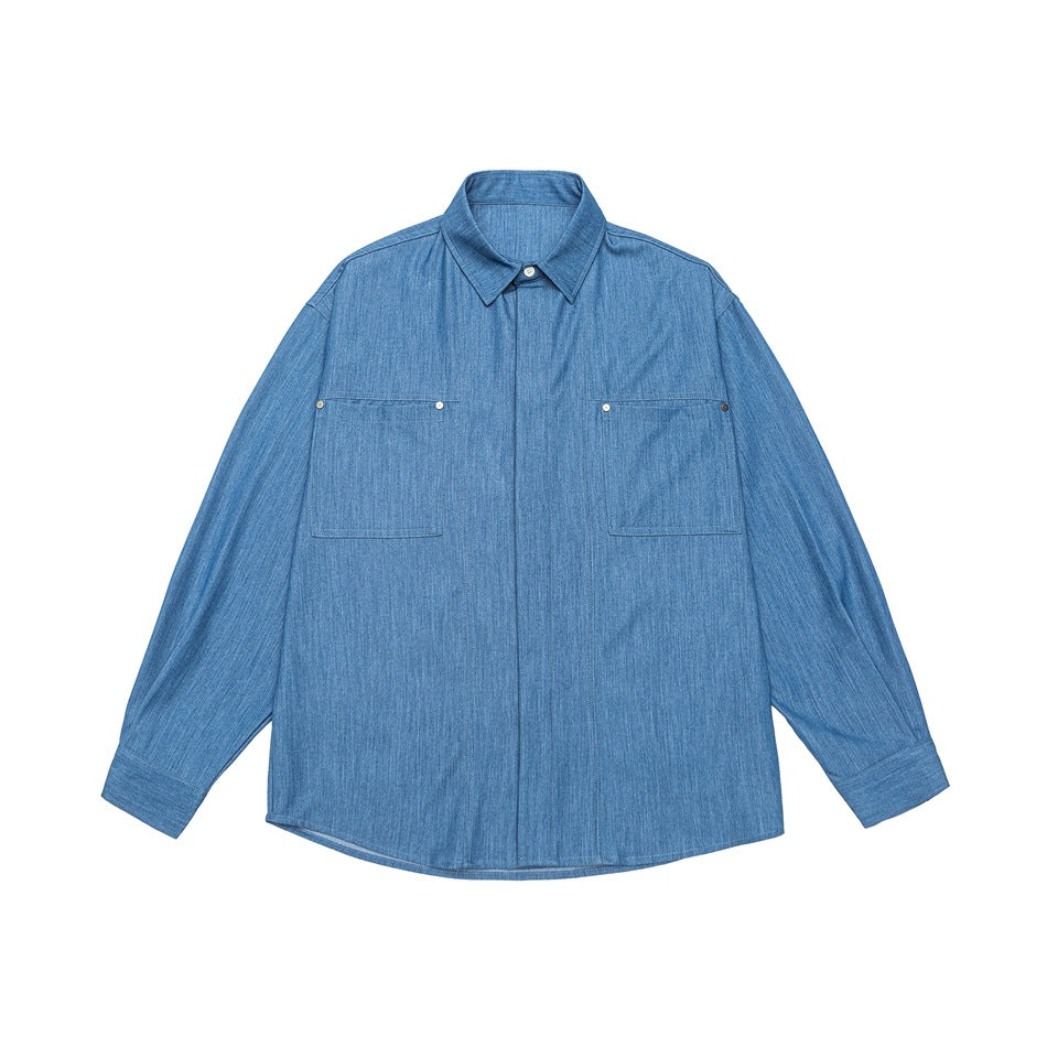 Blue denim-look button-up shirt flat lay, front view, with two chest pockets and concealed placket