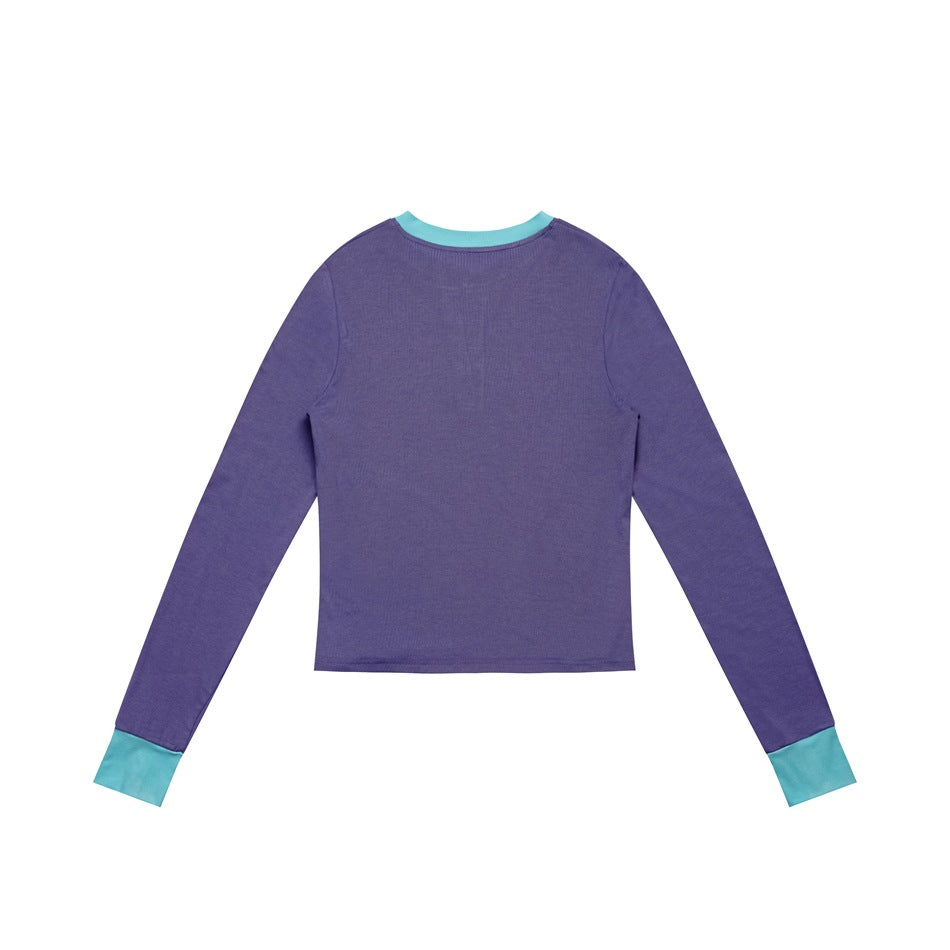 Back view of a purple long-sleeve top with turquoise collar trim and cuffs.