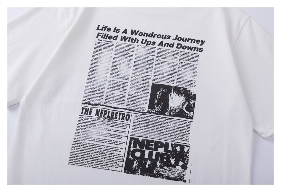 White T-shirt back with a large black newspaper-style graphic, headline, text columns, and photo panels.