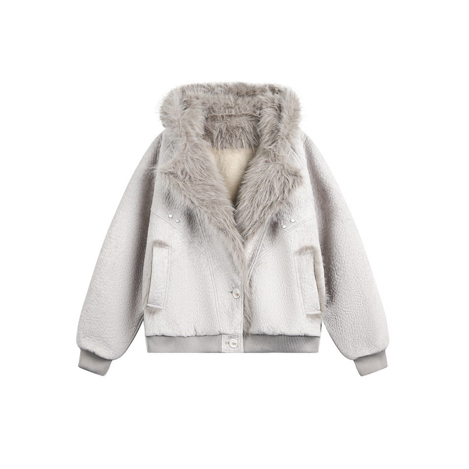 Front view of a light gray hooded jacket with a thick fur-trimmed hood, button closure, pockets, and ribbed cuffs and hem.