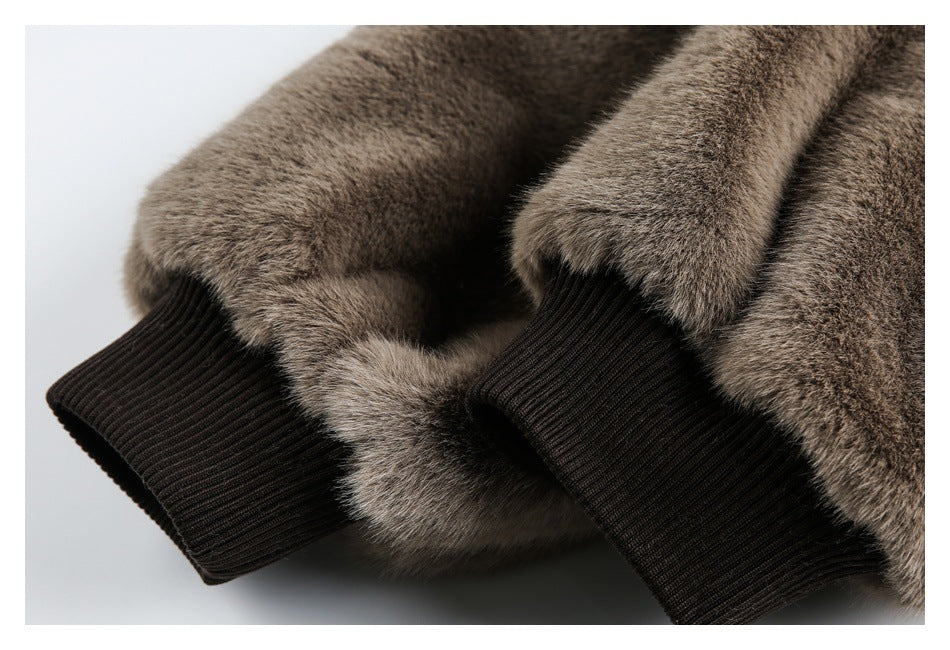 Close-up of brown-gray furry sleeves with dark brown ribbed cuffs.