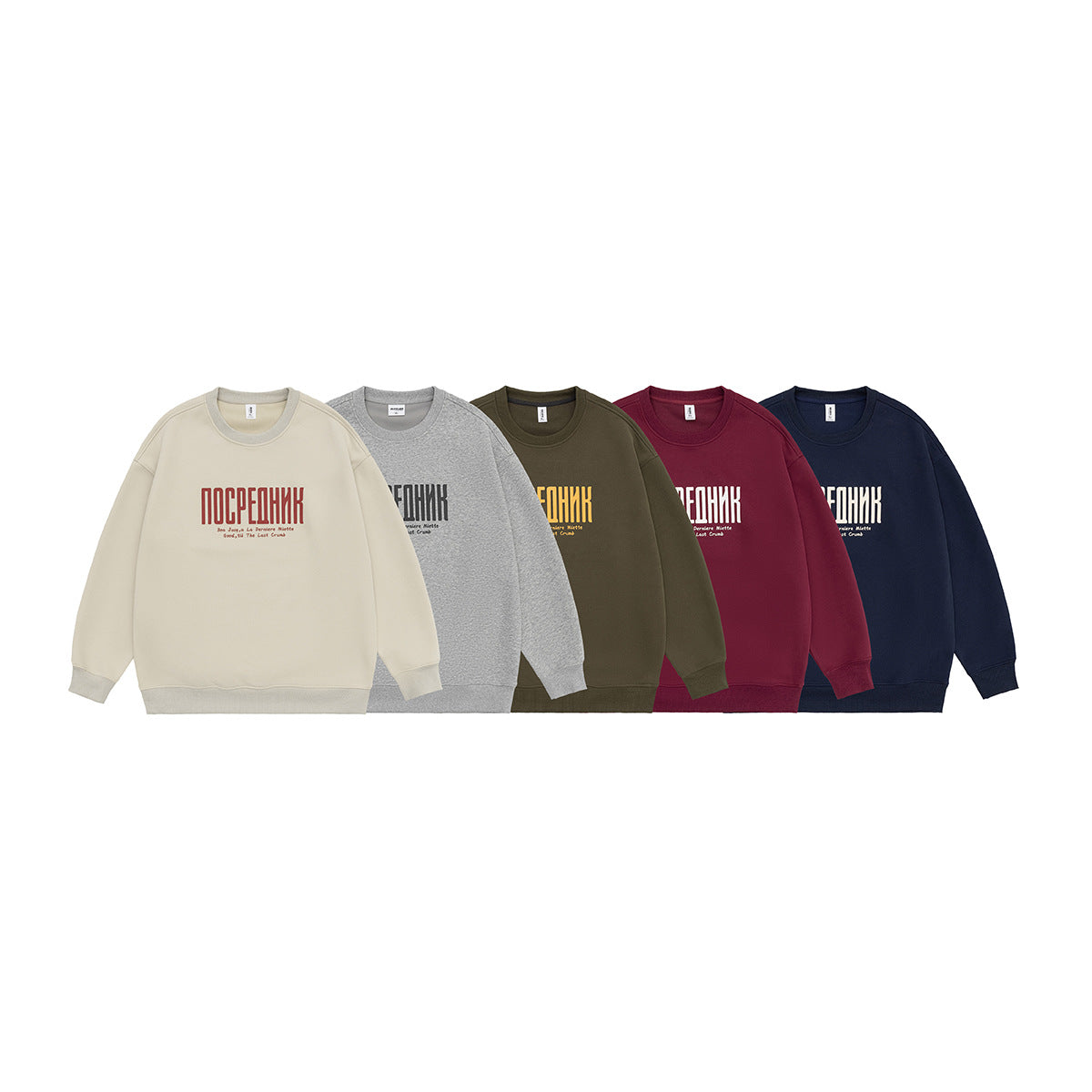 Five crewneck sweatshirts shown together in cream, gray, olive, burgundy, and navy, each with chest lettering.