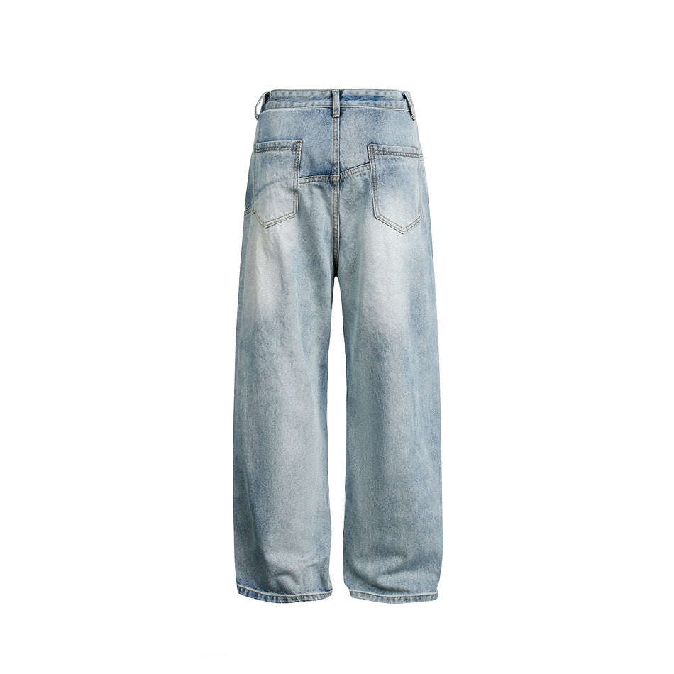 Back view of light-wash, extra-wide-leg jeans with two rear patch pockets on a white background.