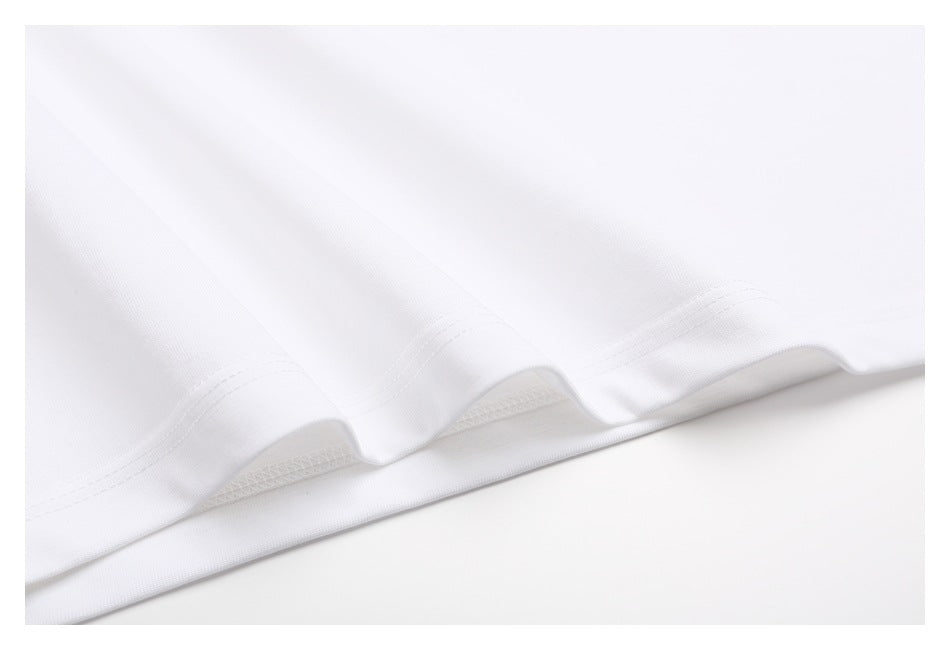 Close-up showing the white T-shirt's double-stitched hem and seam finish.
