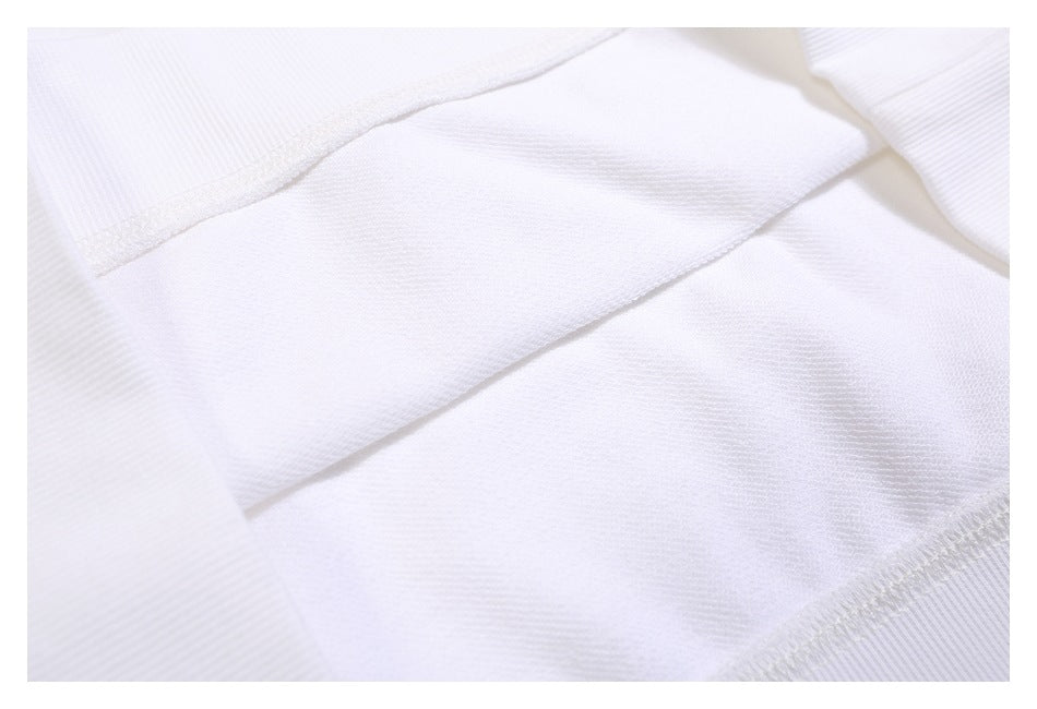 Close-up of the white sweatshirt's interior fabric, seams, and stitching.