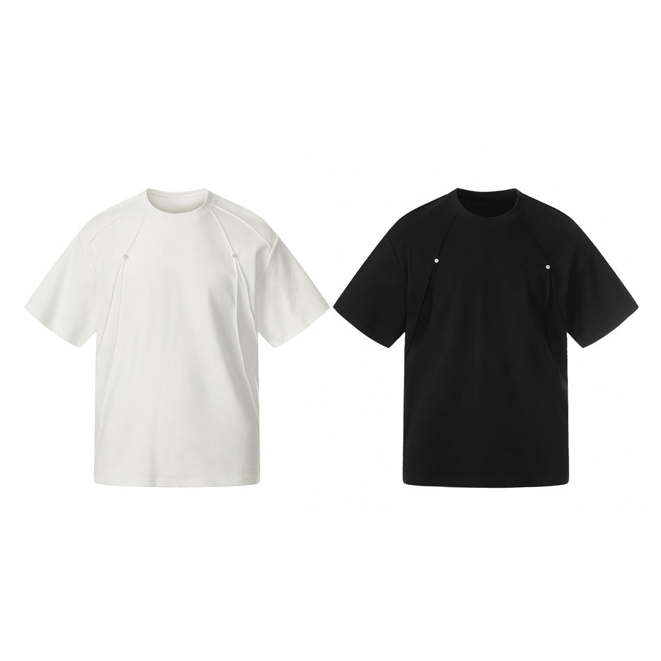 Front views of the short-sleeve tee in white and black, each with curved front panels and small snaps.
