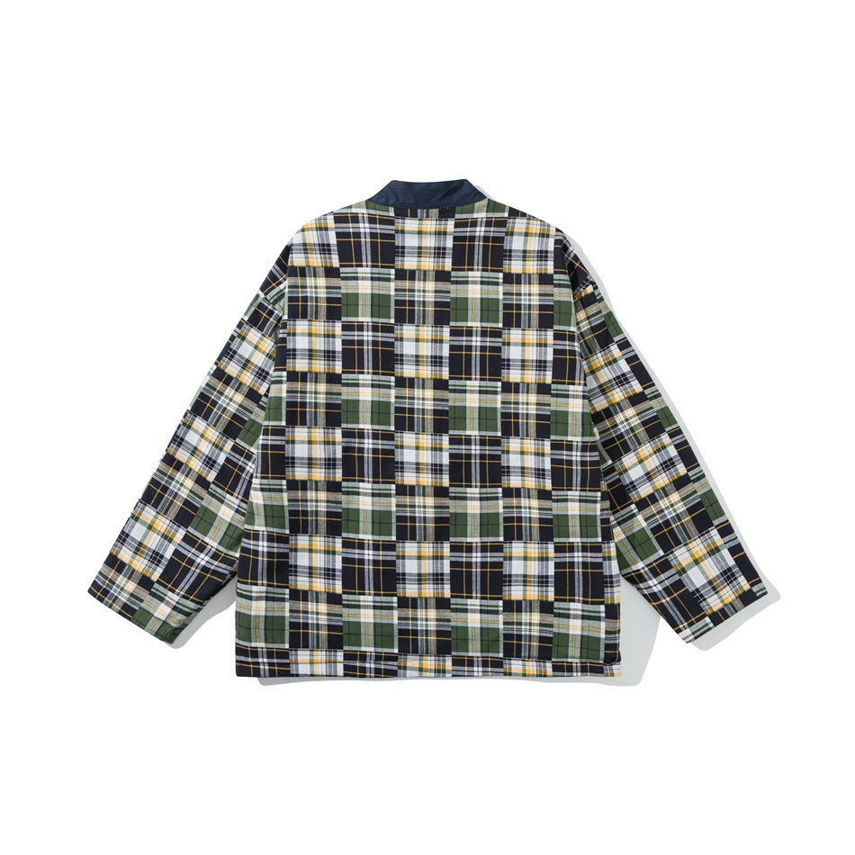Back view of a long-sleeved jacket in navy, white, olive, and yellow patchwork plaid.