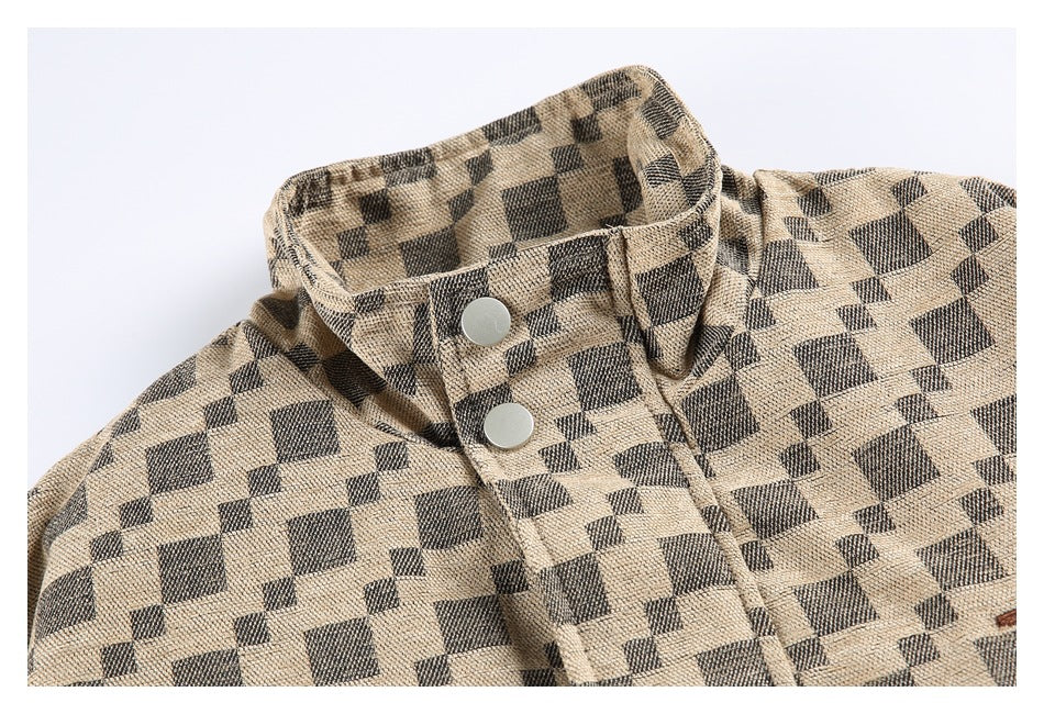Close-up of the jacket's checker-pattern stand collar, front placket, and two silver snap buttons.