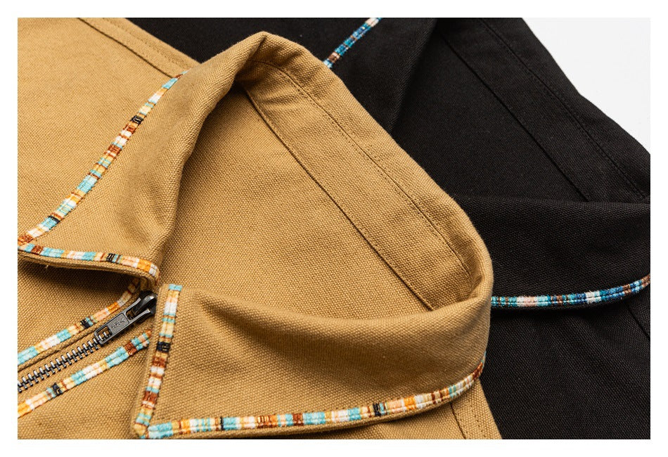 Close-up of tan and black jacket collars with multicolor patterned trim and a visible zipper on the tan jacket.