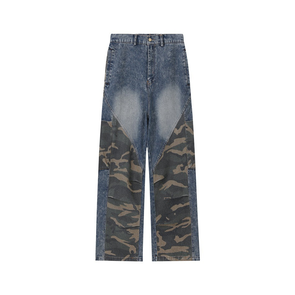 Front of washed blue denim pants with camouflage panels on the lower legs, button fly and belt loops