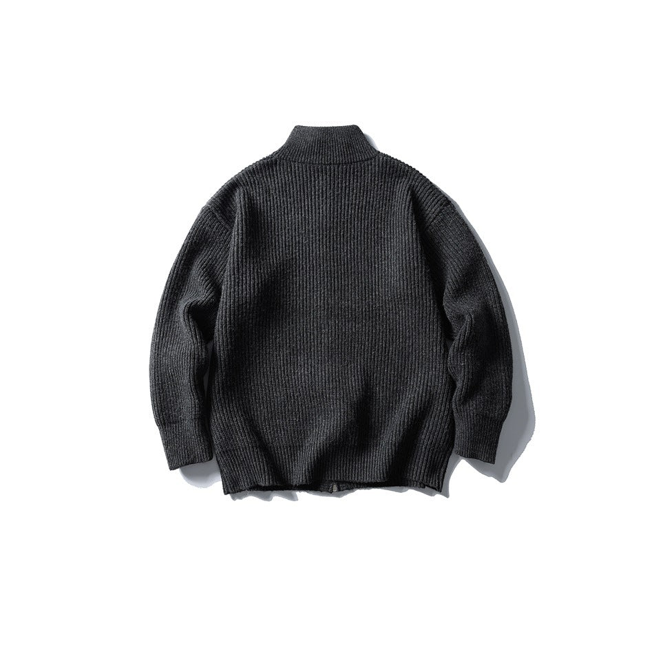 Dark gray ribbed knit sweater, flat lay back view showing stand collar and ribbed cuffs