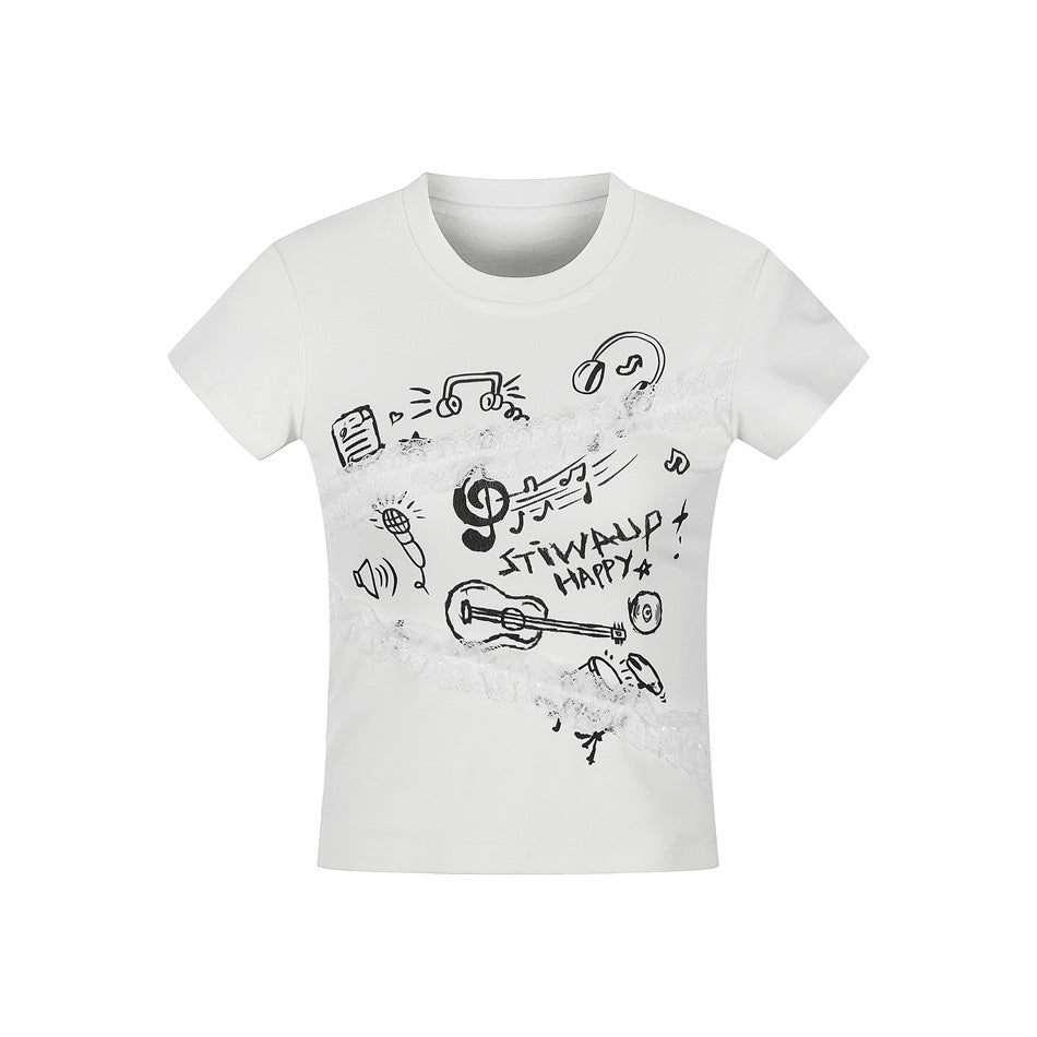 White cropped short-sleeve T-shirt with black music doodle print and diagonal white lace ruffle trim, front view