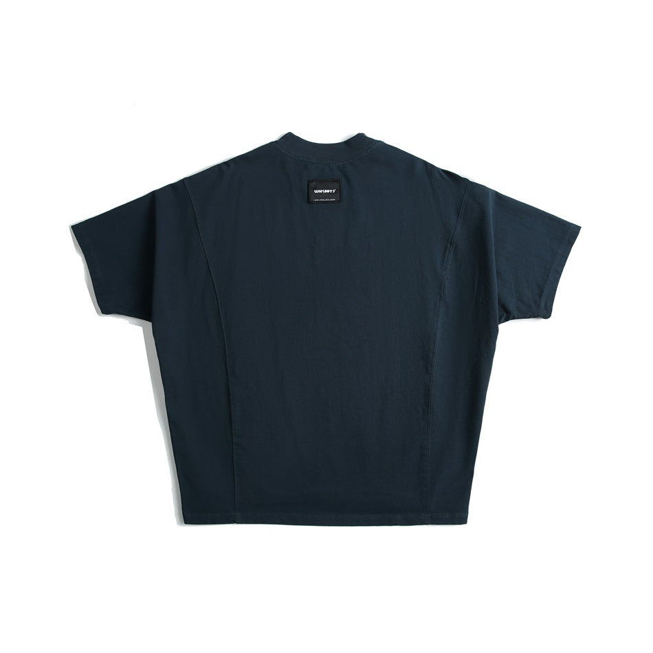 Navy short-sleeve T-shirt back view with curved panel seams, high ribbed neck and small black label