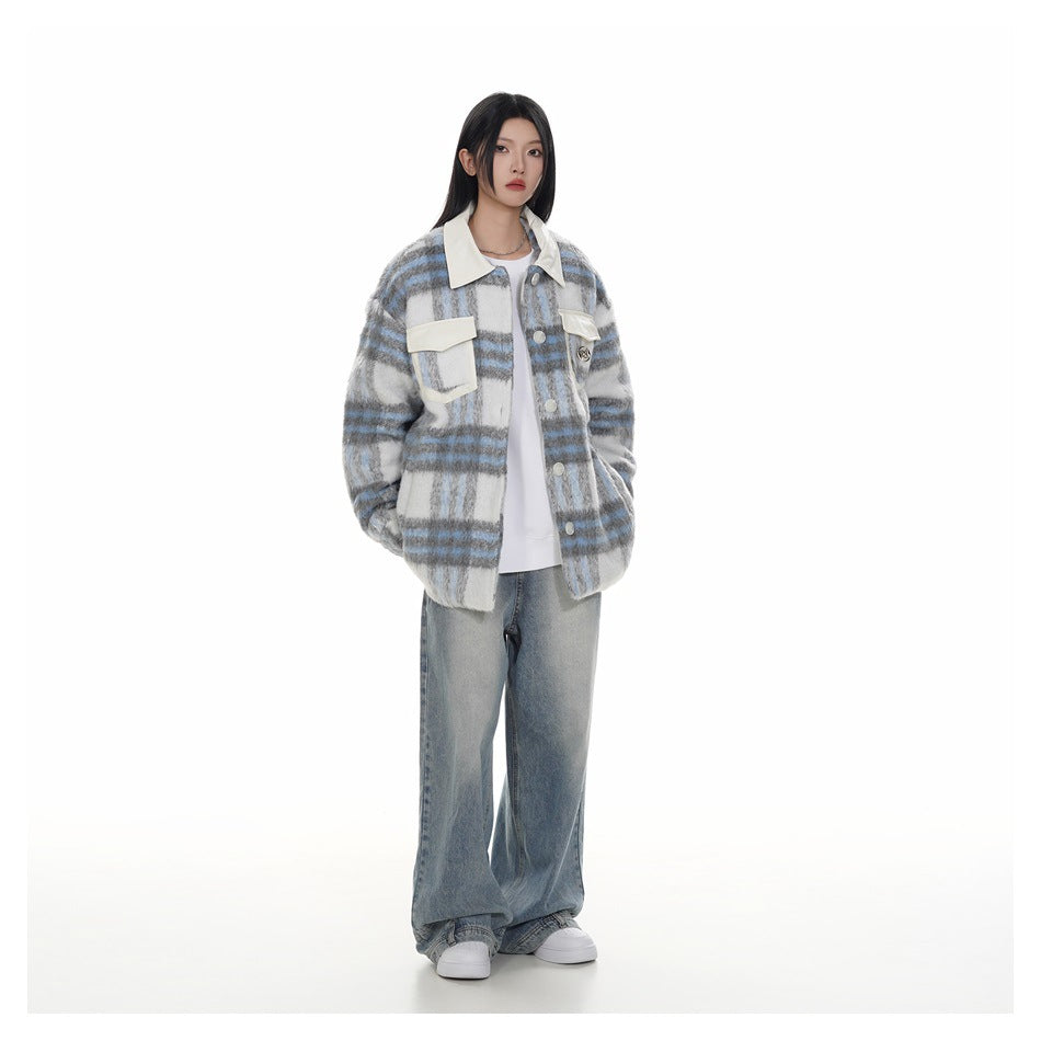 Full-length view of model in a plaid jacket with off-white collar, white top, wide-leg jeans and white sneakers