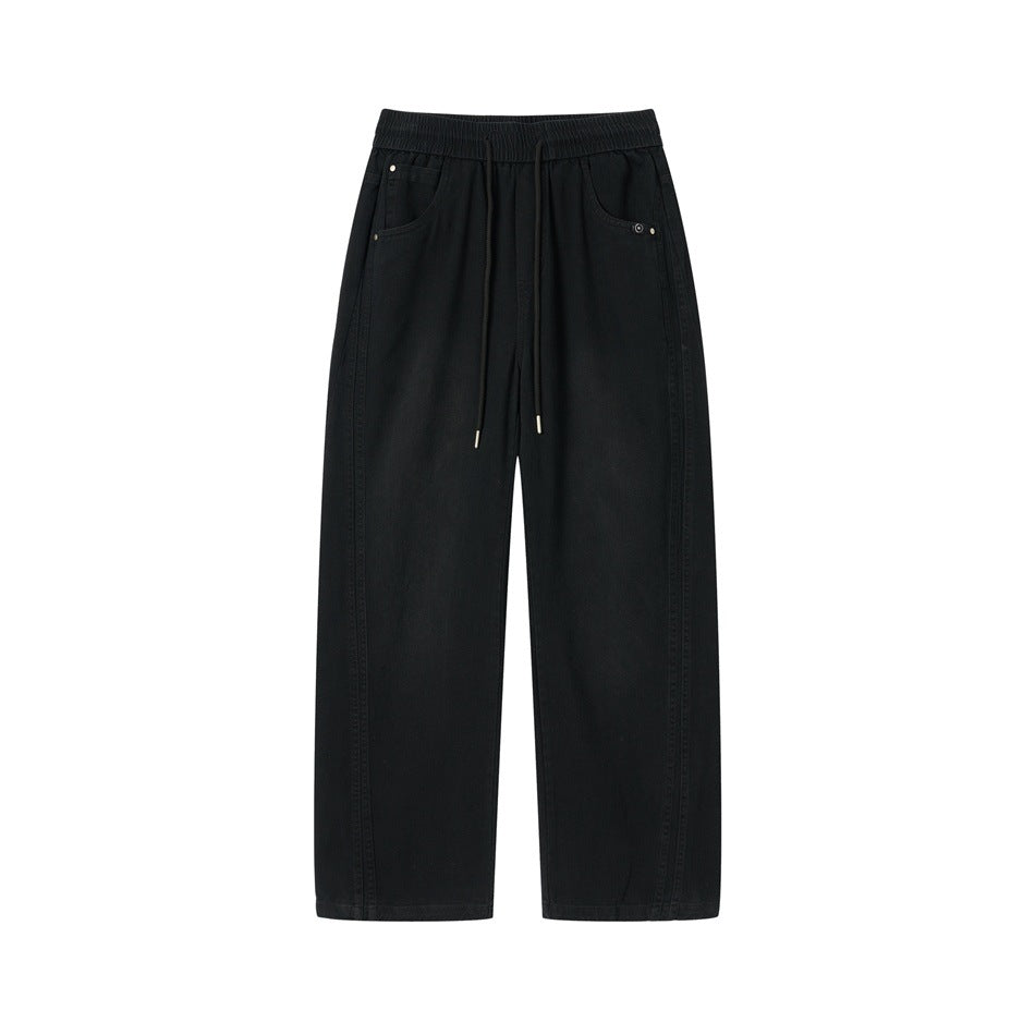 Black wide-leg drawstring pants with elastic waistband and slanted front pockets, flat lay front view