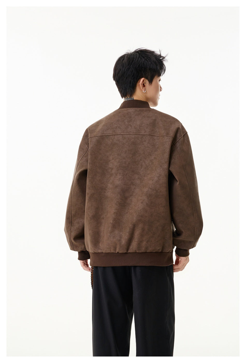 Rear view of a model wearing a brown bomber jacket with ribbed collar, cuffs and hem.