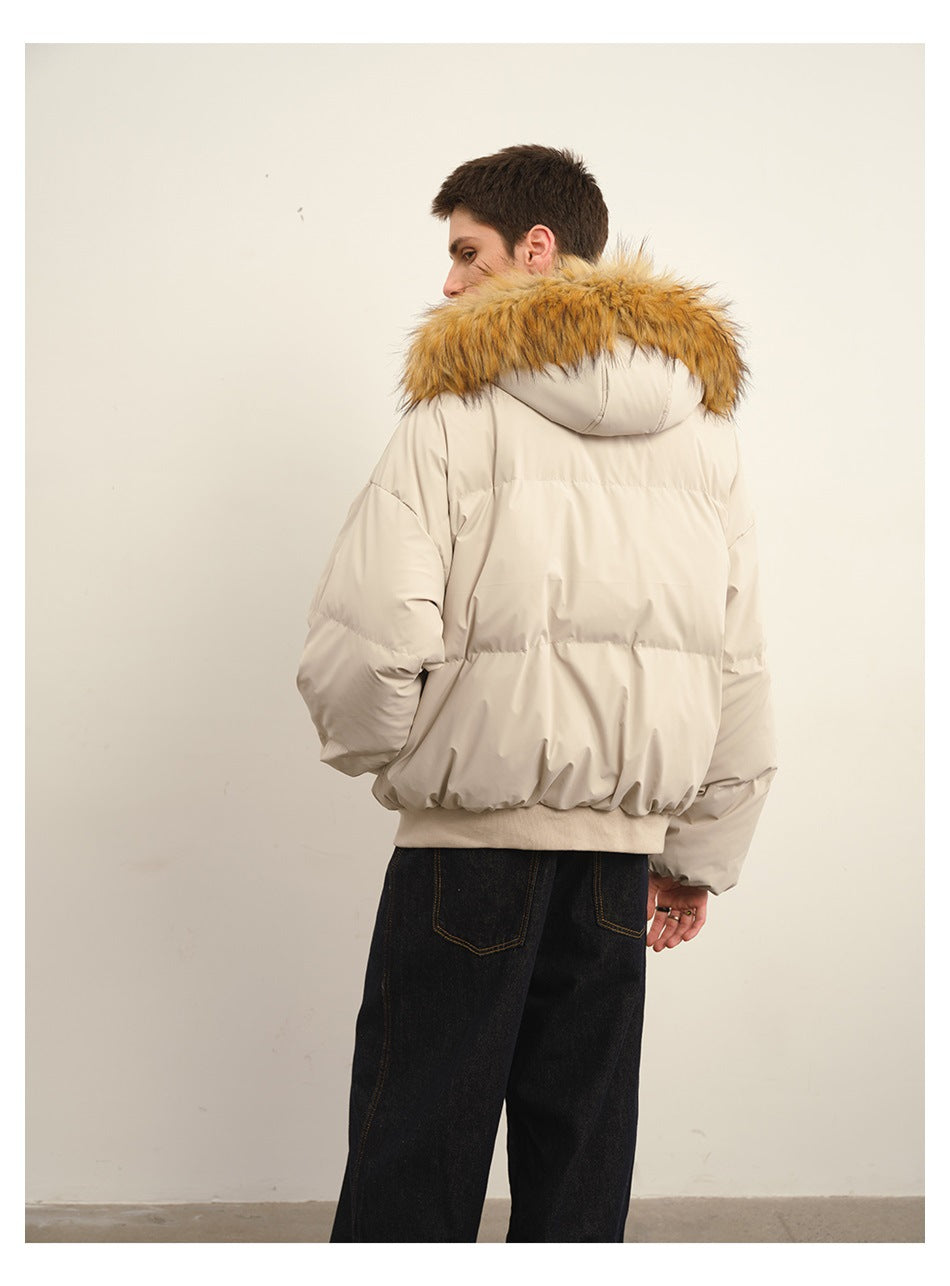 Back view of a man wearing a light beige puffer jacket with a wide tan fur-trimmed hood.