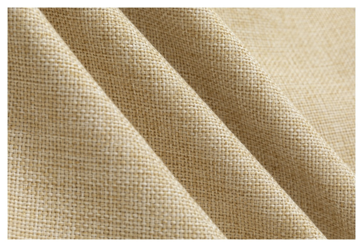 Macro view of the jacket's beige and cream woven surface.
