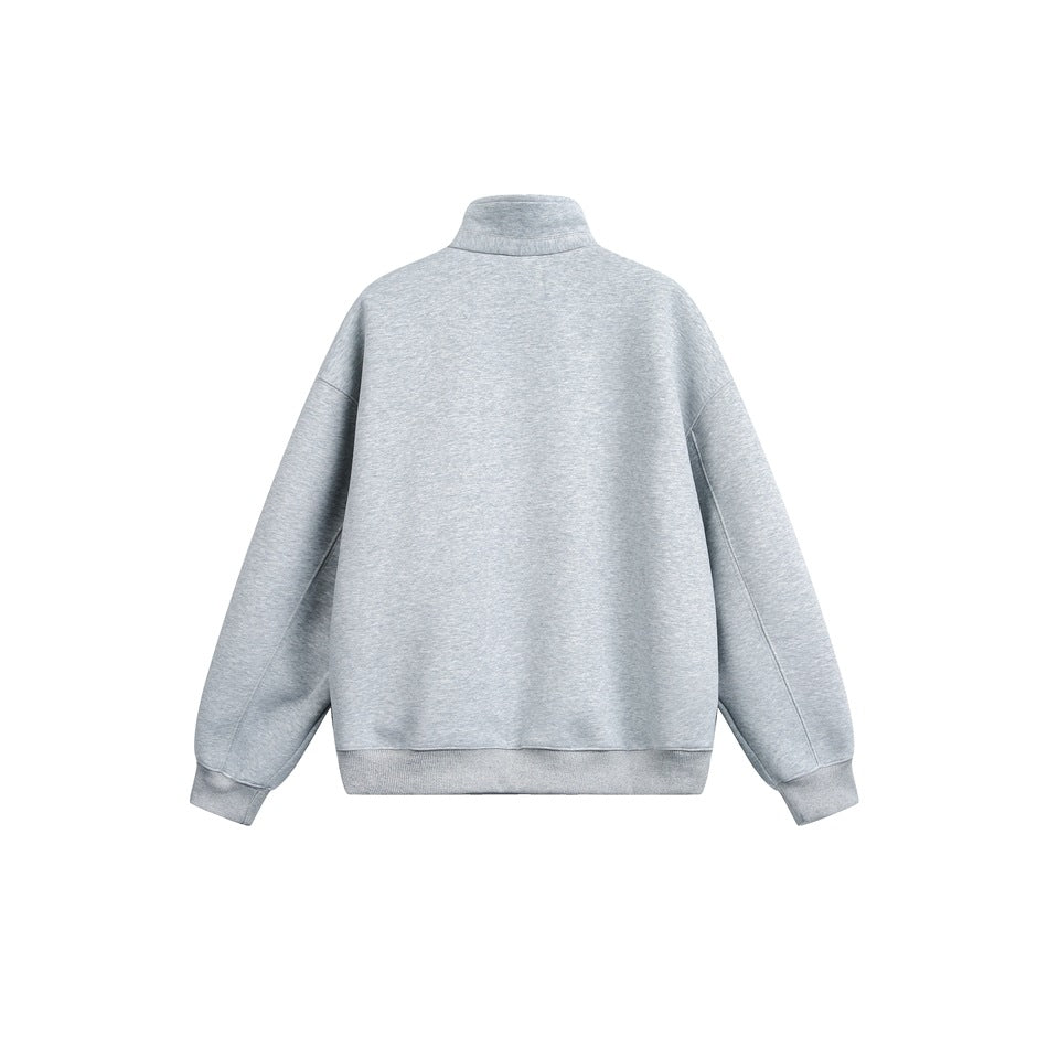 Back view of a light gray pullover with a high collar, dropped shoulders, long sleeves, and ribbed cuffs and hem.