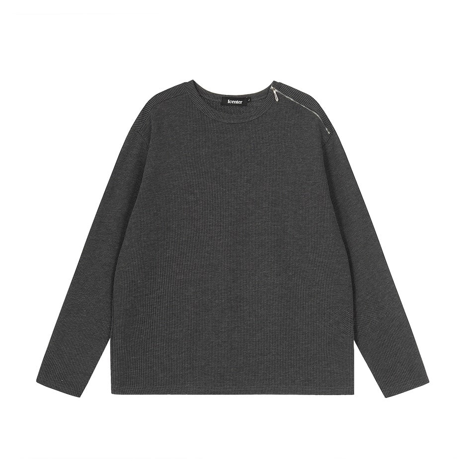 Dark gray long-sleeve crew-neck top with a textured waffle-style knit and a silver shoulder zipper, front flat view