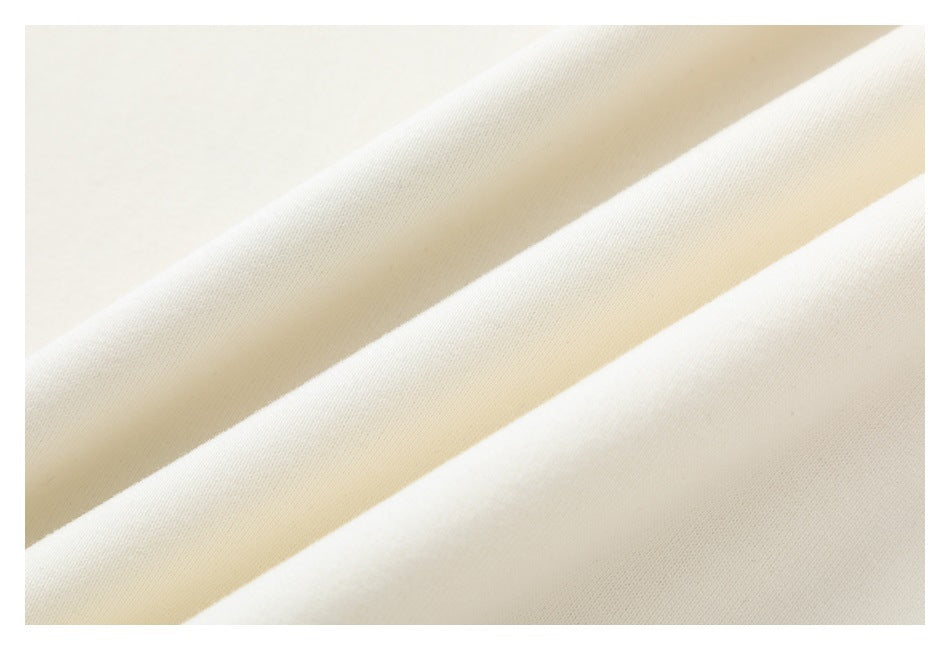 Close-up showing the smooth, light-colored fabric surface and folds.