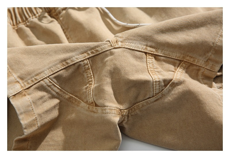 Close-up of the tan trousers' rear seat and crotch seams.