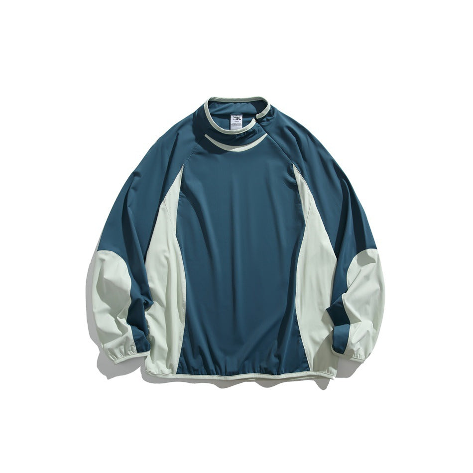 Lake blue pullover with pale mint side panels and sleeves, funnel neck and gathered hem, flat lay front view