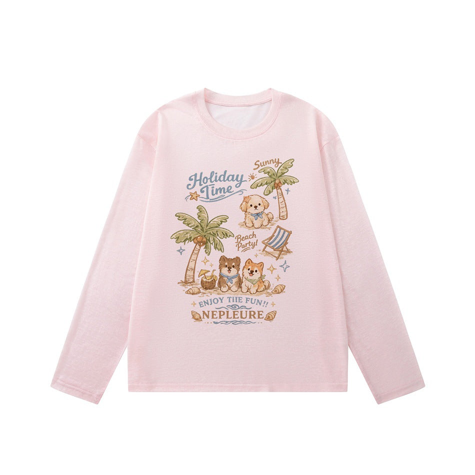 Pink long-sleeve crew neck tee with beach puppies and palm trees graphic, flat lay front view