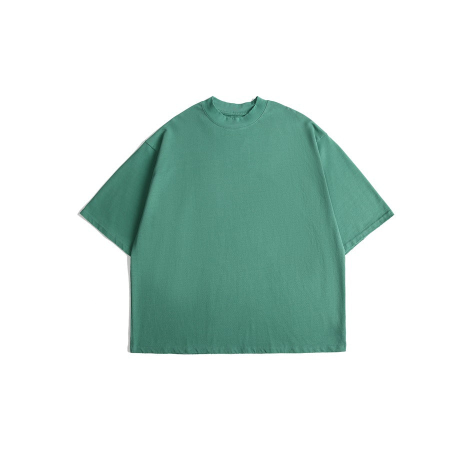 Front view of a plain teal short-sleeve T-shirt with a crew neck.