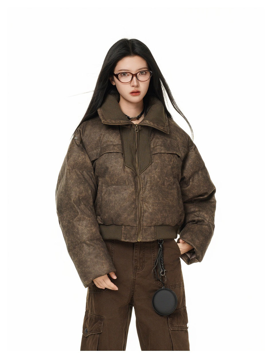 Model wearing the cropped brown quilted jacket with ribbed collar and brown cargo pants, close-up front view