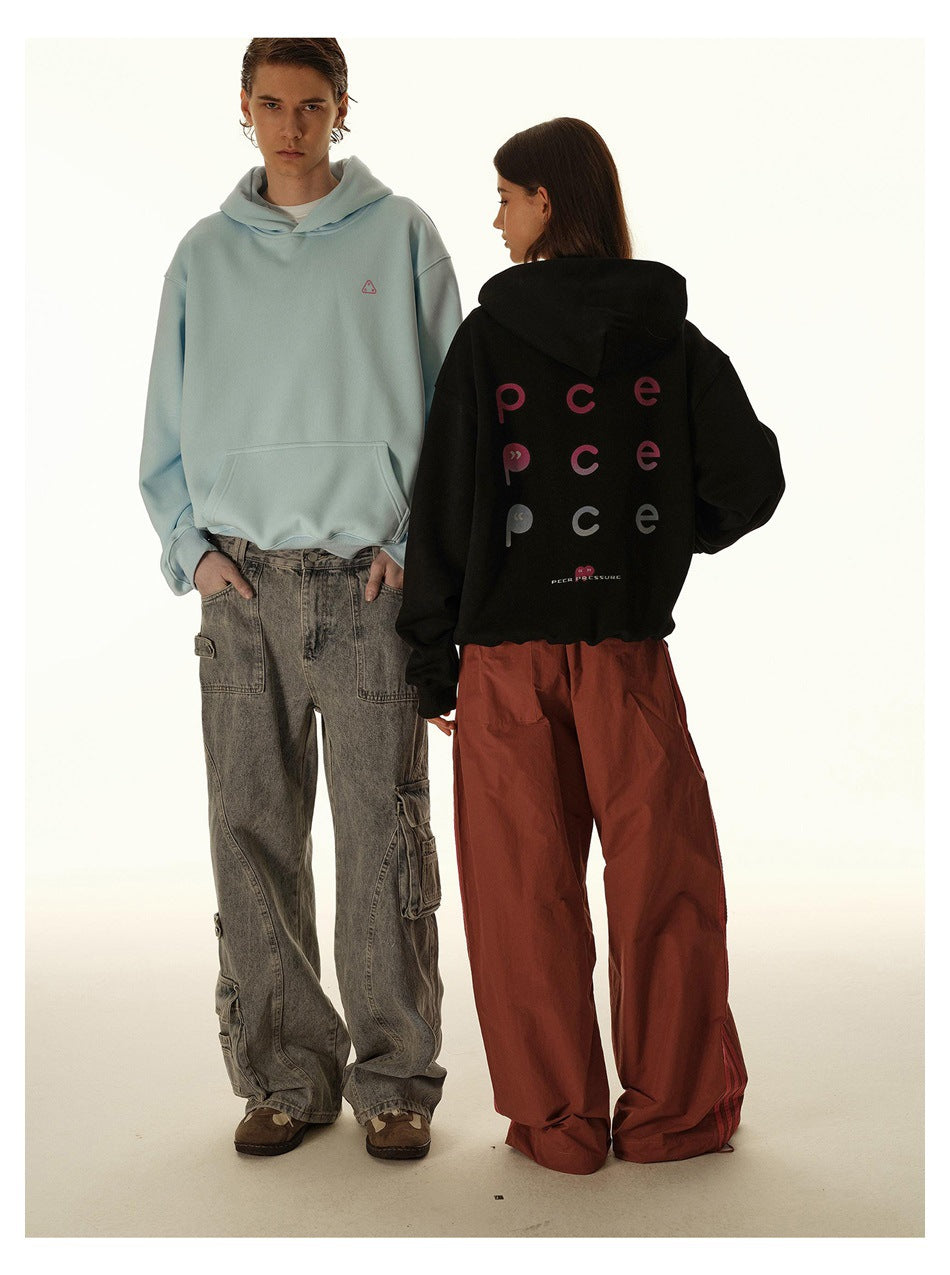 Two models show a pale blue hoodie from the front and a black graphic hoodie from the back.