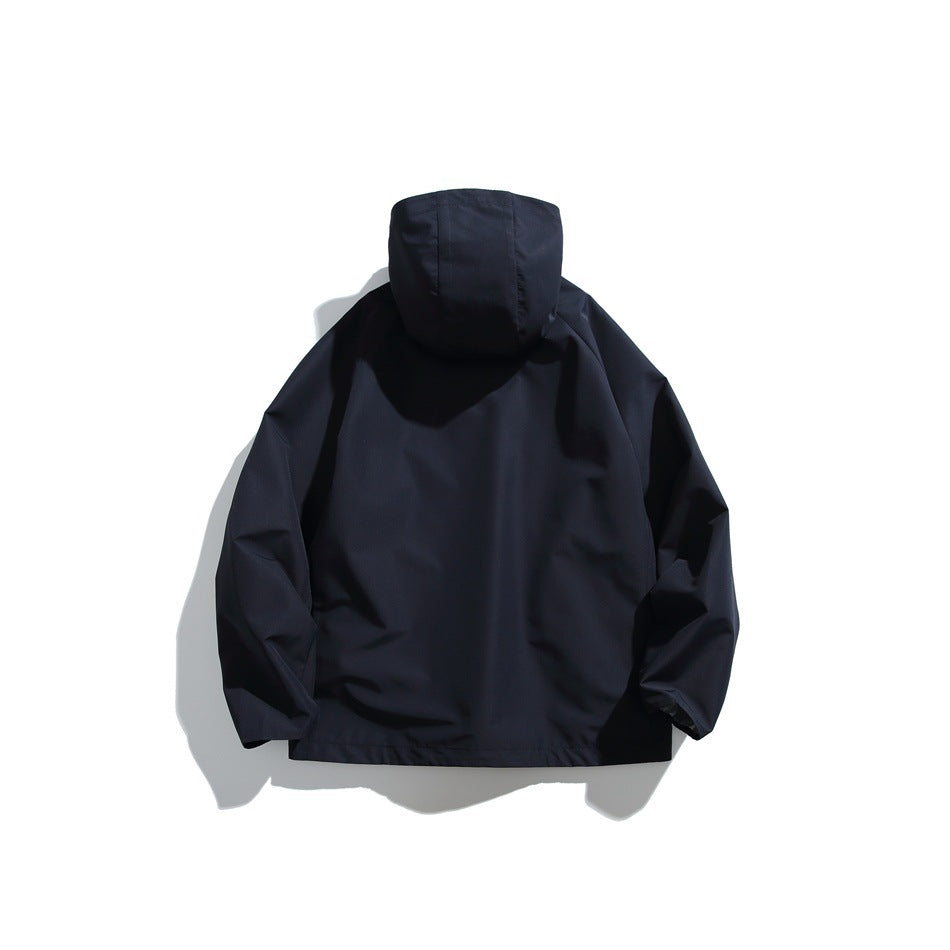 Back view of a dark navy hooded jacket laid flat against a white background.