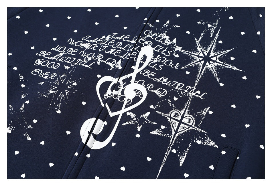 Close-up of a navy hoodie with white heart prints and a large white music-themed graphic.
